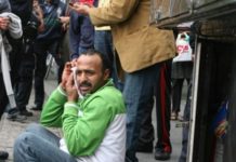 NYC: Hot-Dog Vendor Slashes Rival’s Face Outside Time Warner Center Photos: Robert Miller TUBE STAKES: Hot-dog vendor Houssen Ellaboudiy nurses a razor wound outside Time Warner Center yesterday as alleged slasher Azmy Mansour rants from inside a squad car after his arrest.