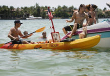 Miami Beach, FL: Family Business Uses Kayaks to Deliver Hot Dogs to Hungry Boaters