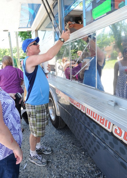 Tom Thornhill, from Glen Burnie, pays for his meal and is then told it could be 20-30 minutes before it was done. The Tikka Tikka Taco truck was at the Annapolis Yacht Club’s Annex. Three competing trucks from Food Network’s The Great Food Truck Race stopped in Annapolis Friday afternoon.