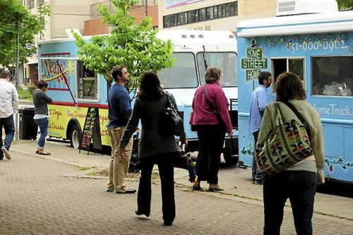 Hungry office workers order food at lunchtime from the Neatos and the Home Street Home food trucks which park on Kellogg Avenue on Thursdays in downtown St. Paul, photographed on Thursday, June 6, 2013. (Pioneer Press: Scott Takushi)