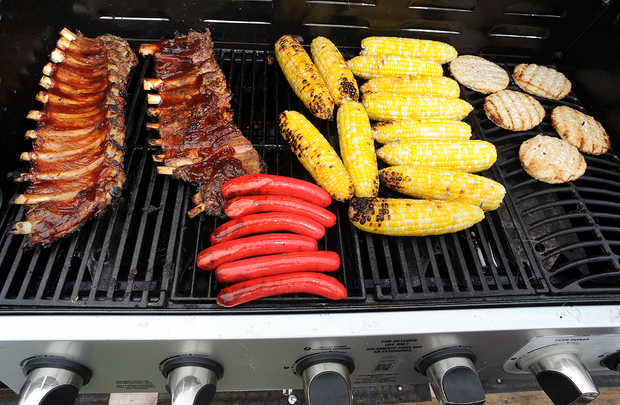 Some barbecue fare cooks on one of several grills at Moose's Mobile Kitchen.