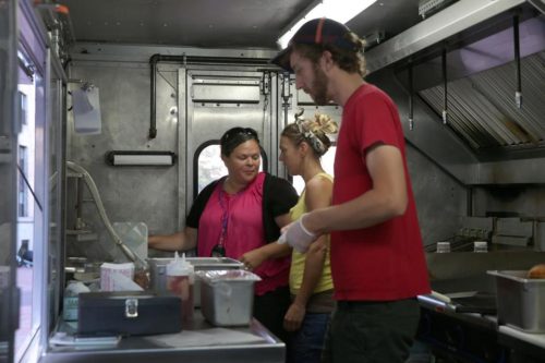 DAVID L RYAN/GLOBE STAFF Geralda Figueroa, a Boston health inspector, told Kim Crocker and Robert MacClean how to avoid violations.