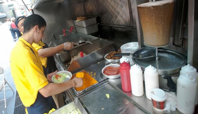 JOHN TAGGART FOR NEW YORK DAILY What’s so great about the food? Several people on line this Monday said that it was the white sauce. “What do they put in there? Magic, maybe?” asked Minsu No, from N.J. 