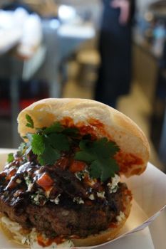 Mendonca grinds the lamb to order for his burger.