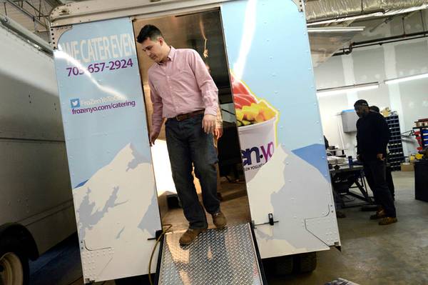 James Jarrell shows off a food truck that is fabricated in his shop.