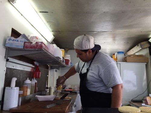 Zona Grill owner Richard Gonzalez puts the finishing touches on the Caraqueña Photo by Patrick Hieger