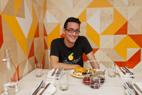 Founder Eric Silverstein within the walls of The Peached Tortilla brick and mortar (Credit: Inked Fingers)