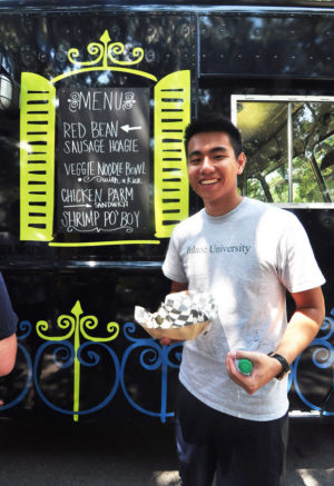 A Tulane student is all smiles as he gets ready to enjoy his taste of local cuisine from Roulez. (Submitted by Mike Strecker)