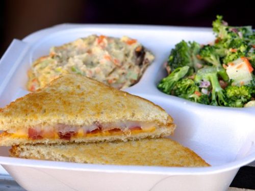 The Jersey Girl Super Foods food  truck features a variety of grilled cheese  sandwiches, including this one, the  Fort Monmouth, with bacon, tomato,  provolone and cheddar. Also  in the box: potato salad and broccoli  salad. (Photo: Chris Kridler/For FLORIDA TODAY)