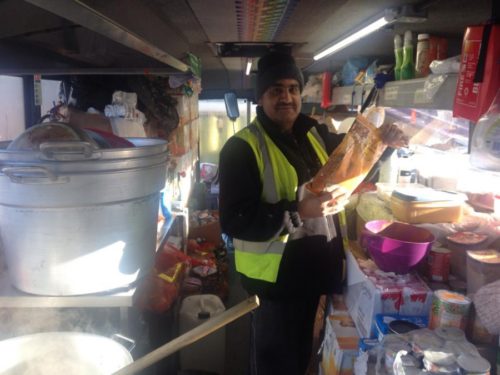 Ghafoor Hussain is the chef in his mobile kitchen. He says his family thinks he's "a bit mad." Credit: Tally Oliver