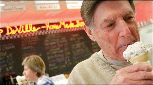 Darrell Lugg of Sheboygan takes a bite from his ice cream cone Wednesday afternoon at Scoop De Ville in Hartford. The restaurant has shown interest in offering food at the concession stand at the new Veterans Memorial Aquatic Center. John Ehlke/Daily News