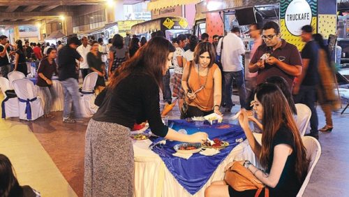 Food lovers munching on varieties of mouth-watering dishes during Food  Truck Street Fiesta at Swamy Vivekananda  Road Metro Station  in Bengaluru on Saturday | Vinod Kumar T