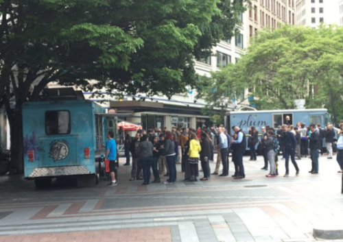 Food trucks in Seattle’s Occidental Square on Wednesday. (Via @DvBnt Twitter)